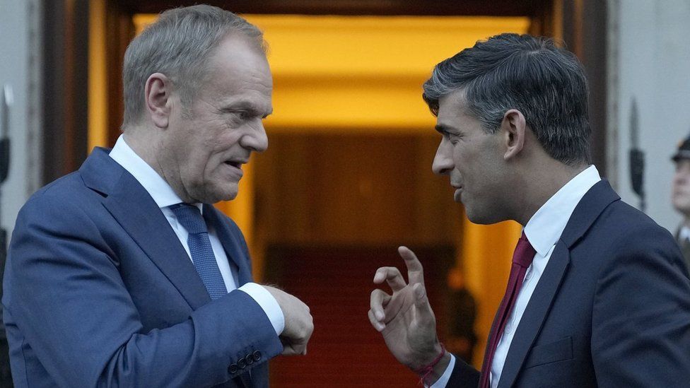 Prime Minister Rishi Sunak (right) chats with Poland's Prime Minister Donald Tusk before he leaves Warsaw, Poland.