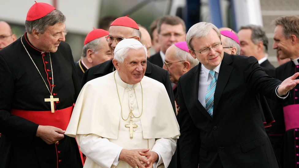 Pope Benedict XVI is welcomed on his arrival in Australia by Cardinal George Pell and Australian Prime Minister Kevin Rudd at the Richmond RAAF Air Base, on July 13, 2008