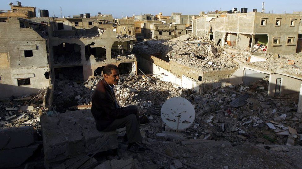 A Libyan man looks at destroyed building in March 2016 in Laithi district, a central area that was reseized by forces loyal to Libya's government