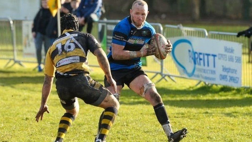 An action shot of Ross Cornwell playing rugby