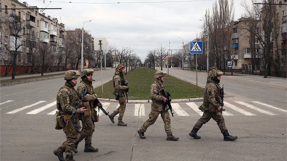 Servicemen of Ukrainian Military Forces walk in the small town of Severodonetsk, Lugansk Oblast, on February 27, 2022.