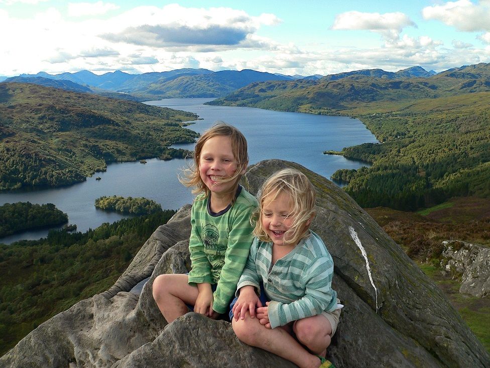 Jack (4) and Finn (2), at the summit of Ben A'an with the stunning backdrop of Loch Katrine in the background.