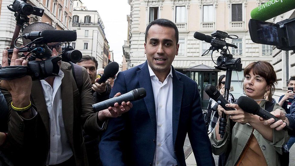 M5S leader Luigi Di Maio surrounded by reporters, 22 May 18