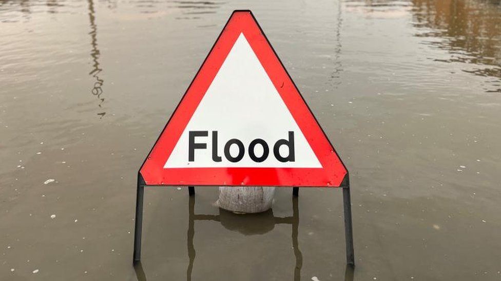 Flood sign in water