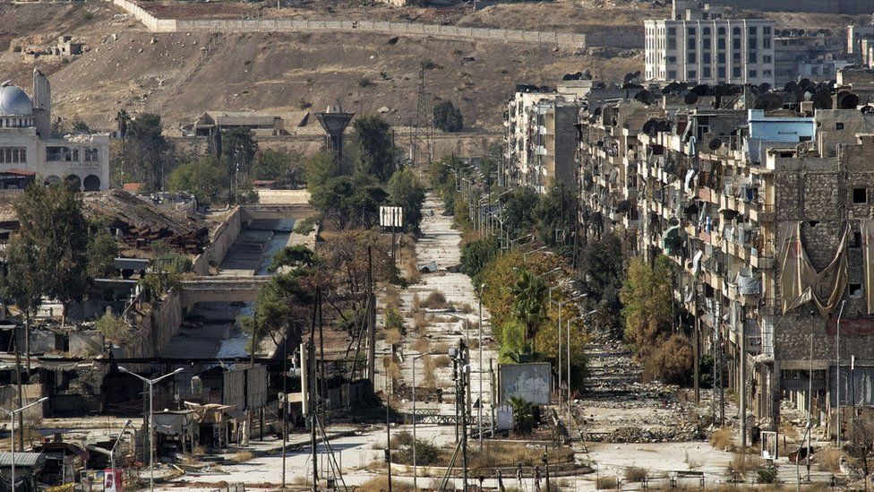 Empty street leading to a crossing point with the government-held neighbourhood of al-Masharka as evacuation corridors opened as part of a Russian-declared ceasefire for Aleppo"s opposition-held areas