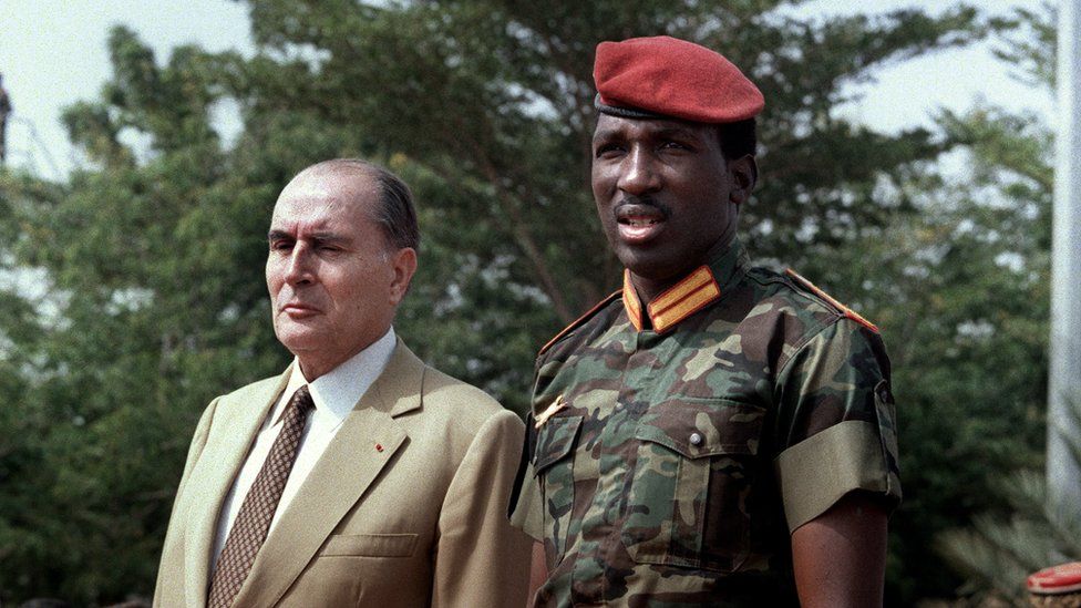 Ex-French President Francois Mitterrand and Captain Thomas Sankara at the Ouagadougou airport in 1986.