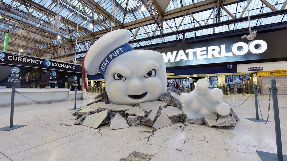 Stay Puft Marshmallow Man is seen on the concourse at Waterloo Station