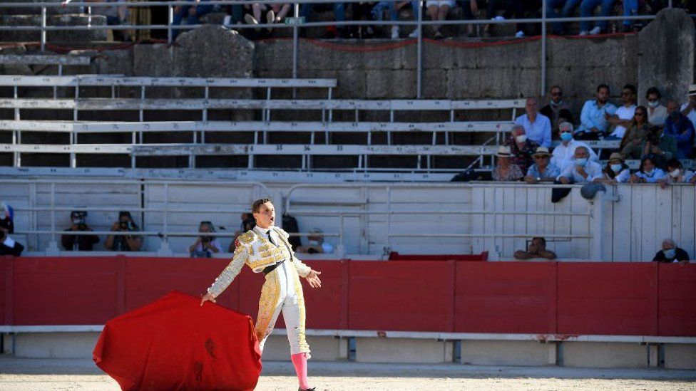 French matador Adrien Salenc gestures in the arena of Arles, southern France, on June 6, 2021, on the opening day of the Arles Feria