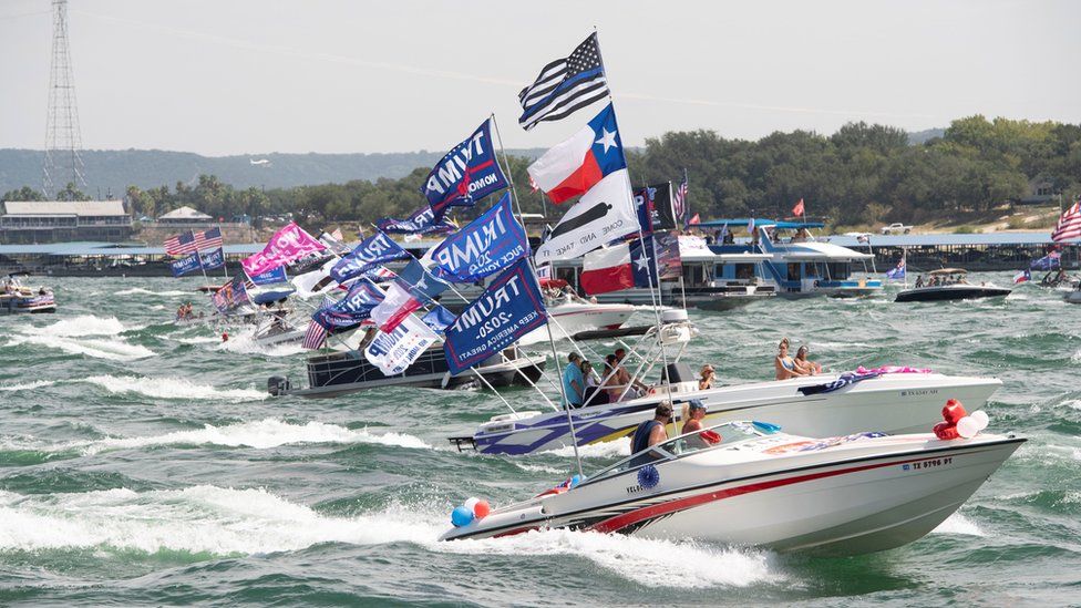 Boats take part in a parade of supporters of US President Donald Trump on Lake Travis near Lakeway