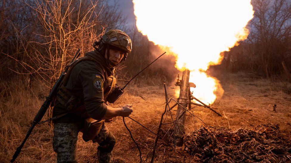 A Ukrainian soldier fires a mortar in Bakhmut