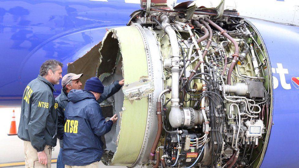 NTSB investigators examining damage to the engine of the Southwest Airlines plane in this image released from Philadelphia, Pennsylvania, April 17, 2018