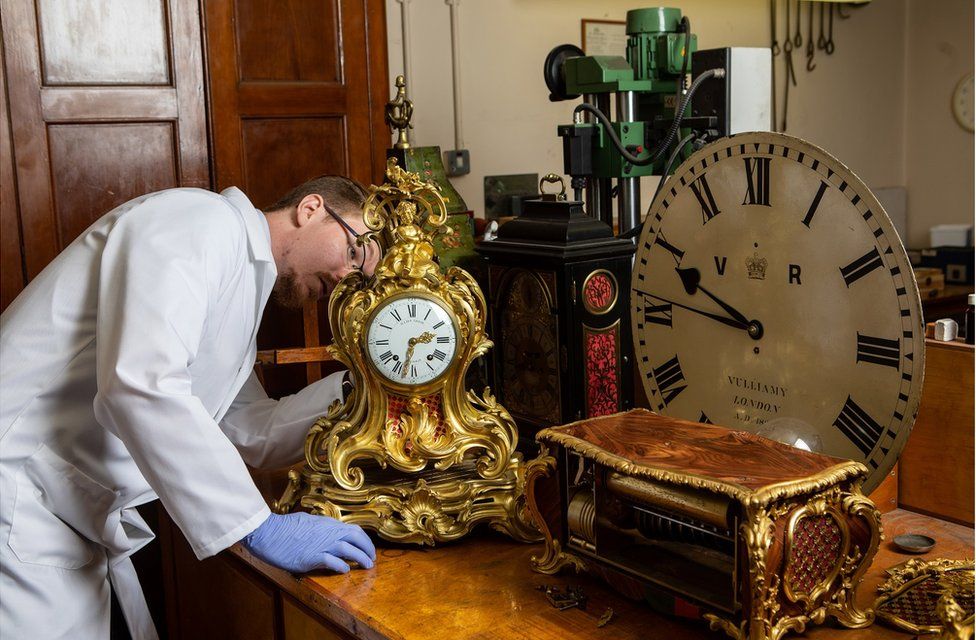 Fjodor working on a gold clock in his workshop