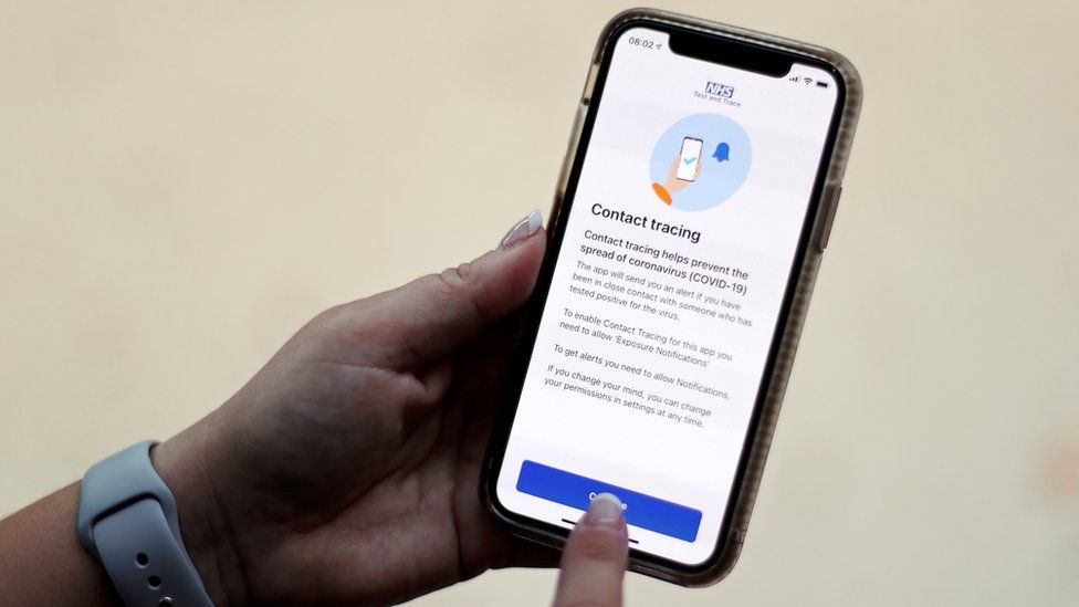 The coronavirus disease (COVID-19) contact tracing smartphone app of Britain's National Health Service (NHS) is displayed on an iPhone