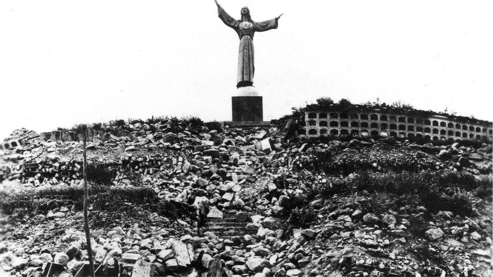 Statue of Christ at Cemetery Hill overlooking Yungay, which together with four palm trees, is all that remained of the city.