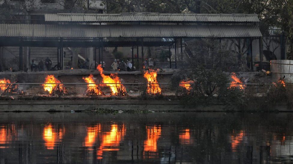 Burning funeral pyres at a crematorium in Lucknow city, ne of the worst-hit in India.