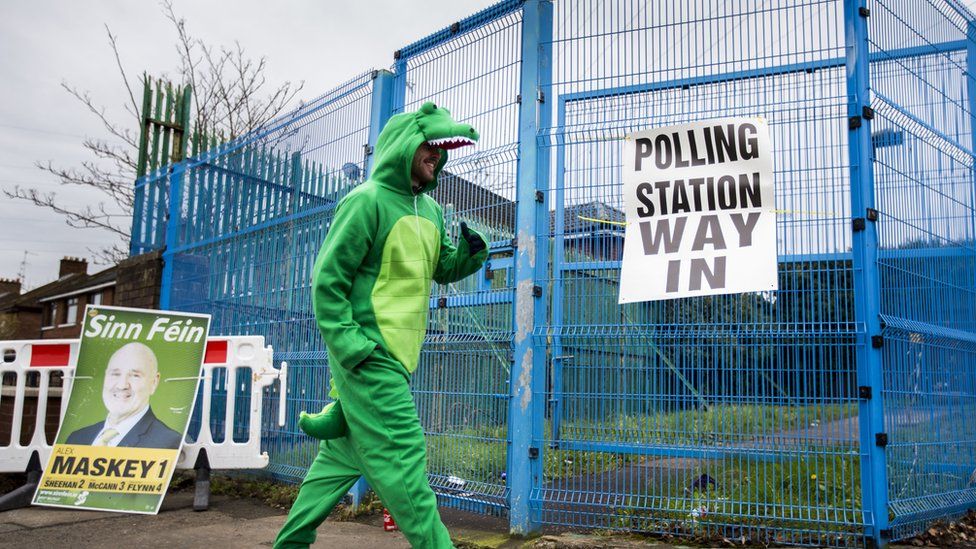 Irish language activist Dominic Sherry casts his vote at a West Belfast polling station