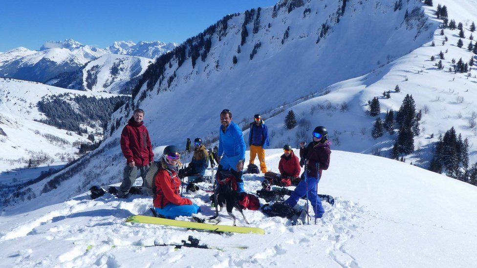 A group of friends, including Marc Sutton, on a mountain in France