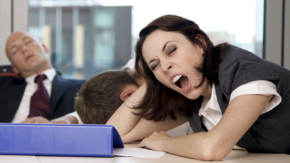 People yawning and asleep in the office