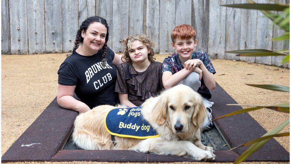 Family photo with Mum, Karen, with Josselin younger brother Dalton and Stormzy the guide dog
