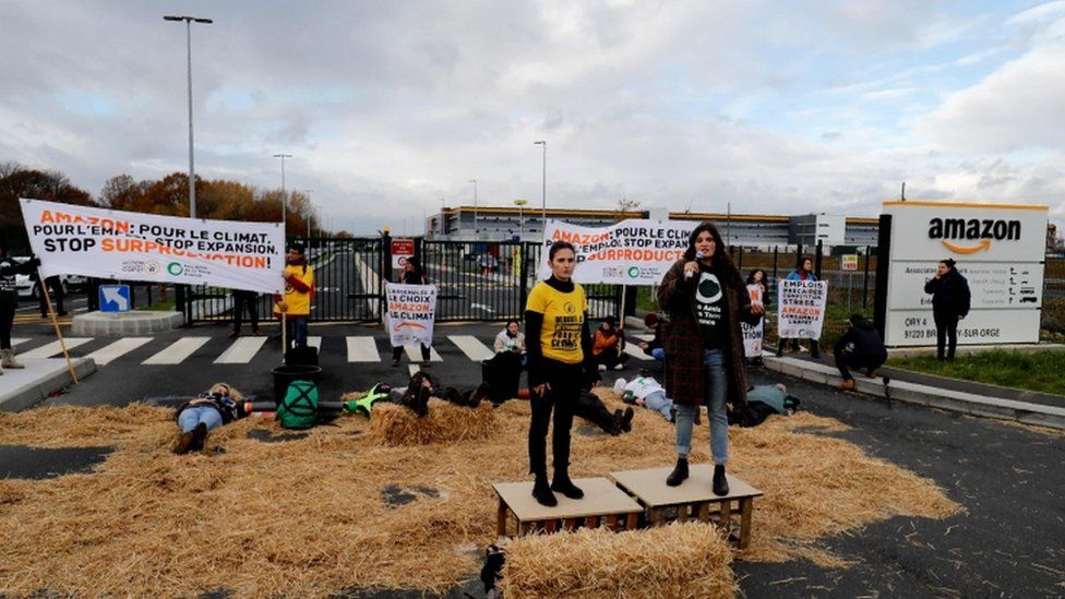 Activists block an Amazon centre in Bretigny-sur-Orge to protest the company's impact on climate change