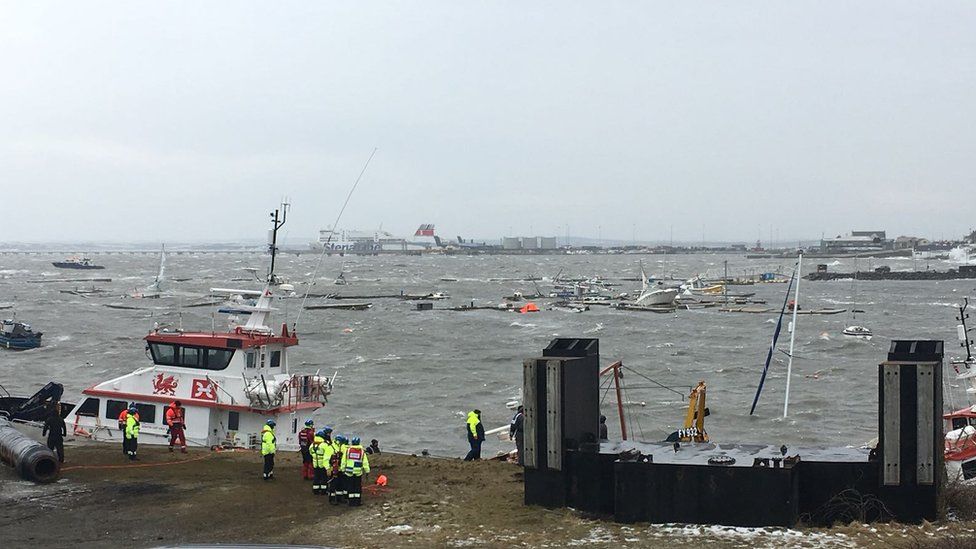 Holyhead marina - coastguard teams asses damage following Storm Emma