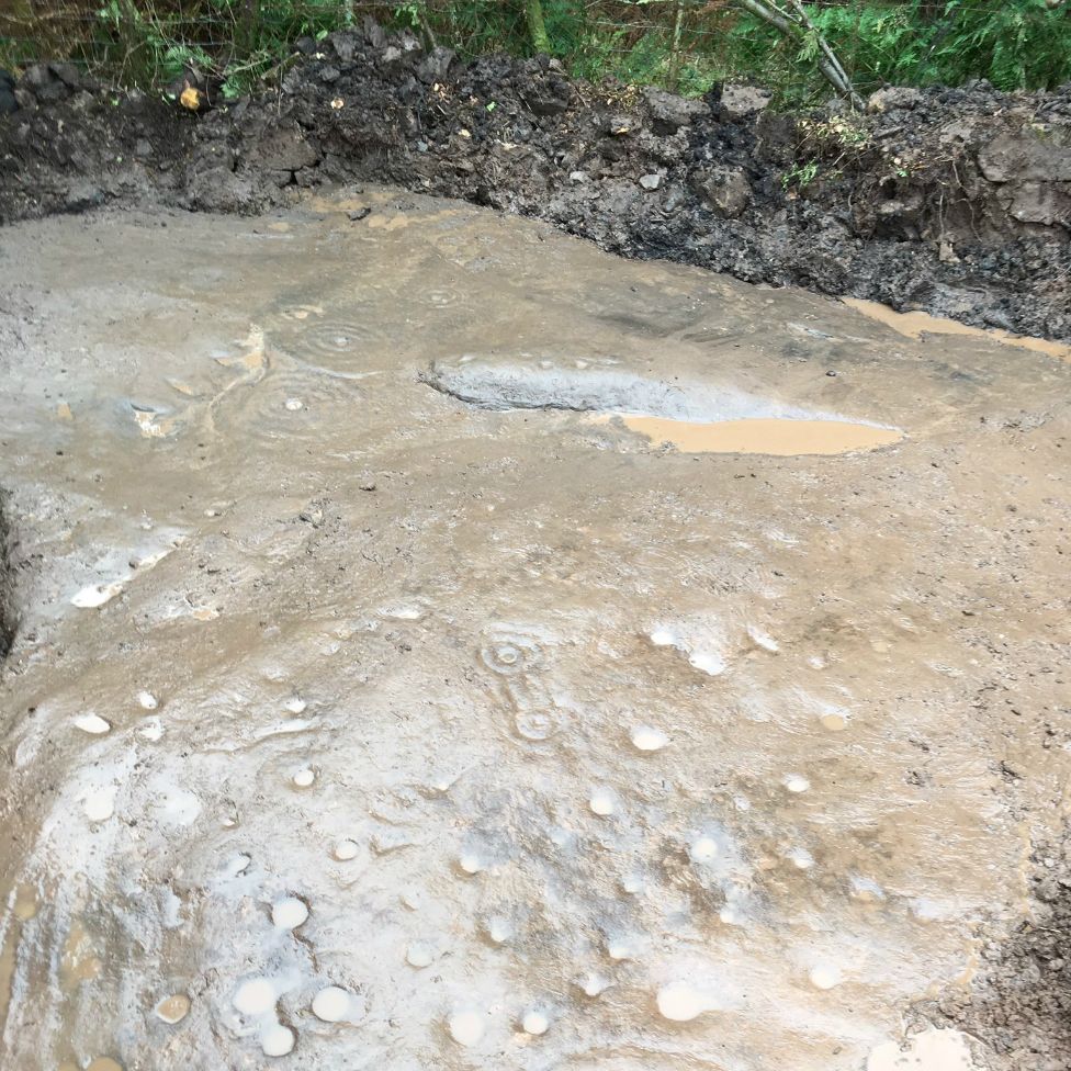 Prehistoric Cochno Stone unearthed near housing estate - BBC News