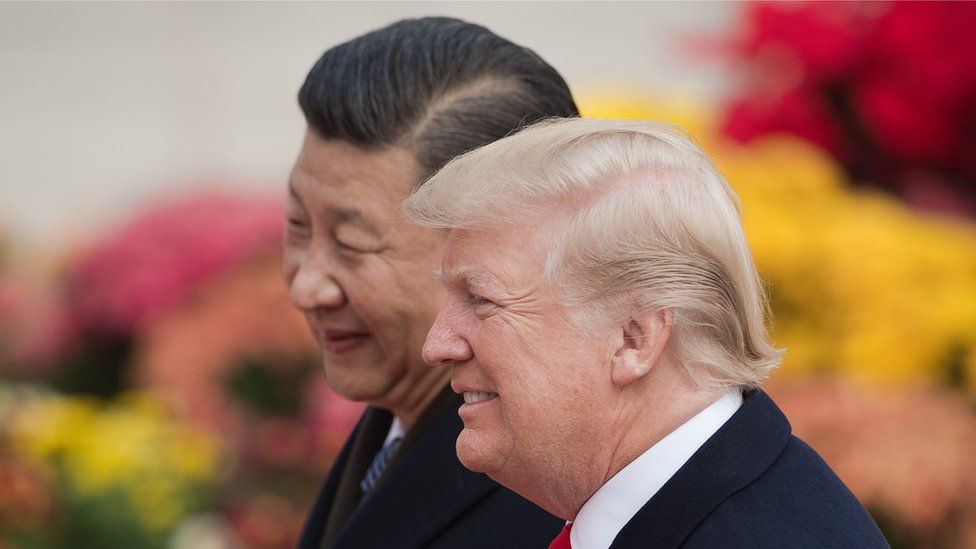 China's President Xi Jinping (L) and US President Donald Trump attend a welcome ceremony at the Great Hall of the People in Beijing on November 9, 2017.