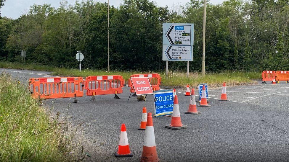 A326 road sign and police closure