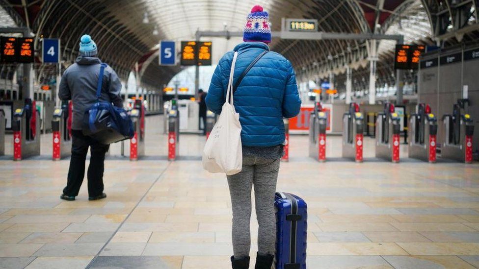 Passengers at train station