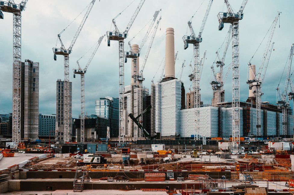 Construction cranes surround Battersea Power Station in London