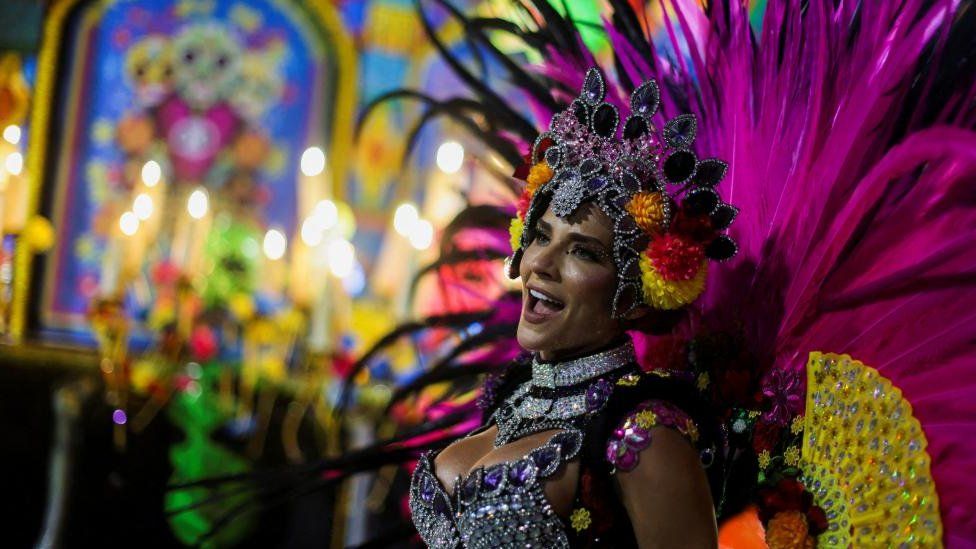 A member of the Unidos de Vila Isabel samba school perform during a parade at Avenida Marques de Sapucai in the Sambadrome, during the Rio de Janeiro Carnival, in Rio de Janeiro, Brazil, 20 February 2023.