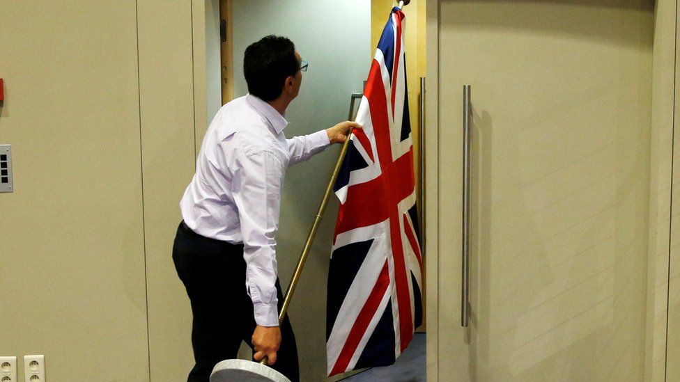 Brussels official carrying UK flag, 20 Jul 17