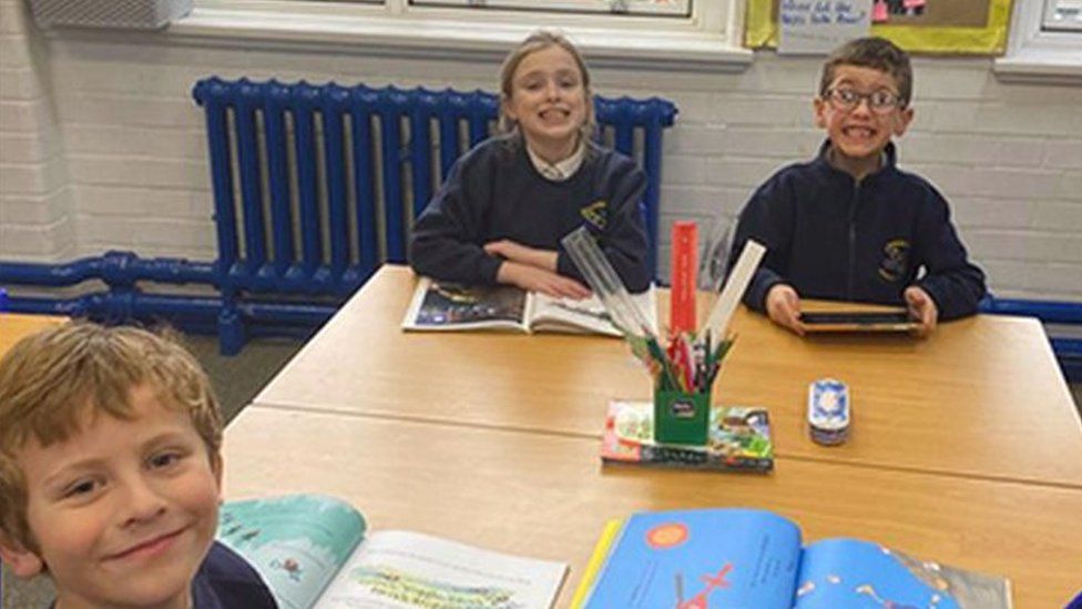 Children by an open window at Egremont Primary School