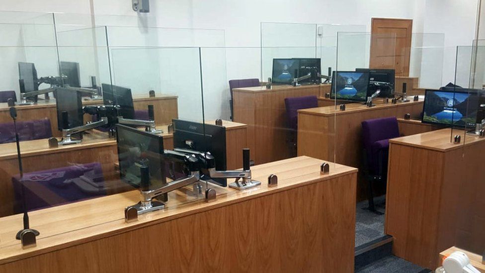 An example of the socially-distanced court room