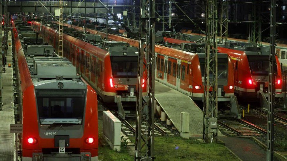 Local trains stand in front of the Main Train Station during a German Train Drivers' Union (GDL) strike in Frankfurt, Germany