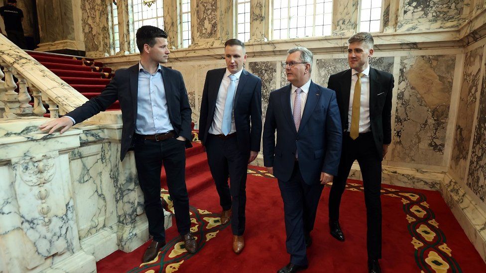 Jonathan Buckley MLA, Councillor Andrew McCormick, DUP leader Sir Jeffery Donaldson and Councillor Dean McCullough at the Northern Ireland council elections at Belfast City Hall