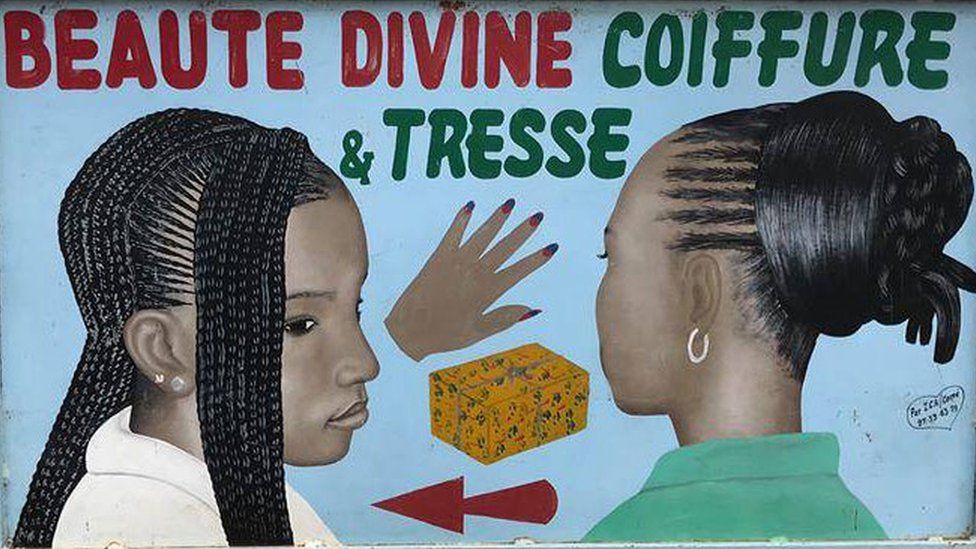 A hair salon hand-painted advertisement sign