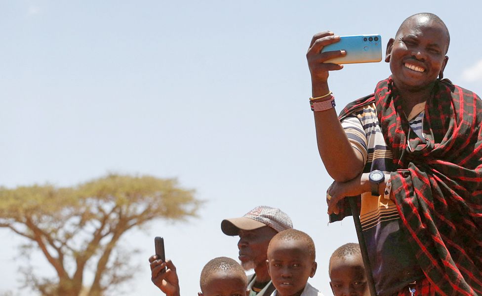 A Maasai man using his mobile phone to record in a village in Kajiado County, Kenya - Sunday 26 February 2023