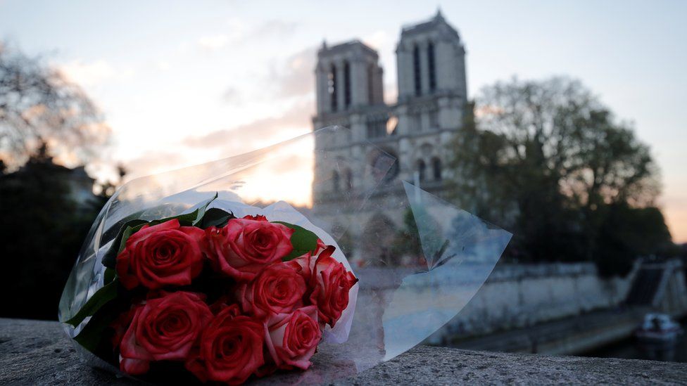 Flowers laid outside Notre-Dame cathedral in Paris, April 2019