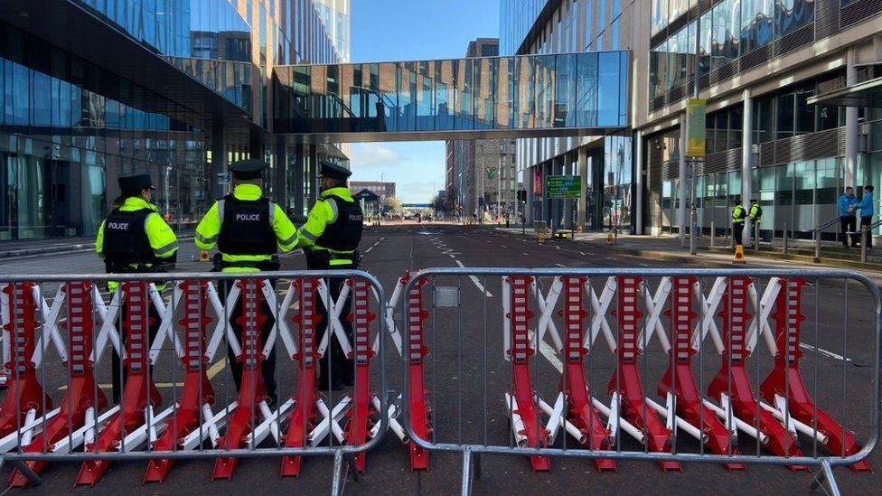 Police officers guard a cordon at to Ulster University