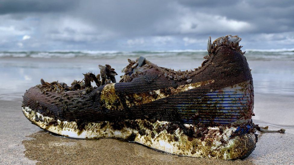 Why are Nike trainers washing up on - BBC News