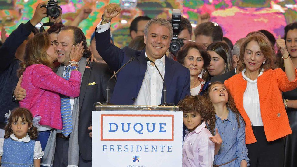 Newly elected Colombian president Ivan Duque (C) celebrates with his family and supporters in Bogotá, after winning the presidential runoff election on June 17, 2018
