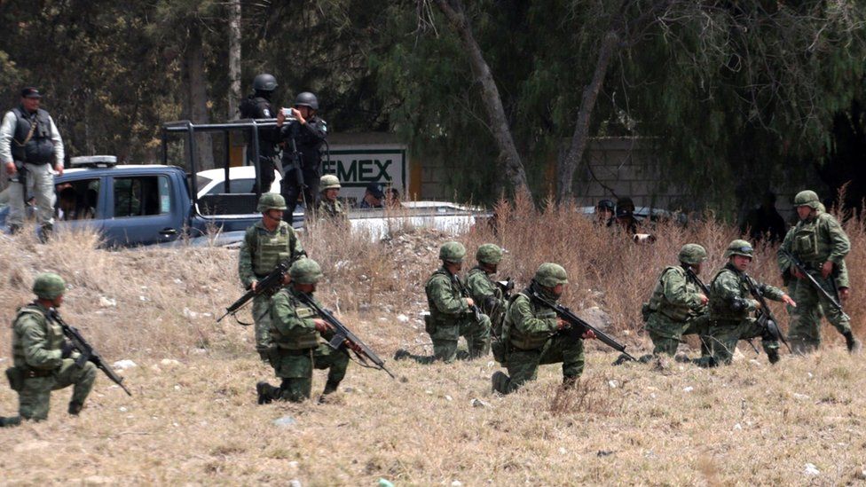 Mexican soldiers on patrol in Palmarito last week after clashes with alleged oil thieves