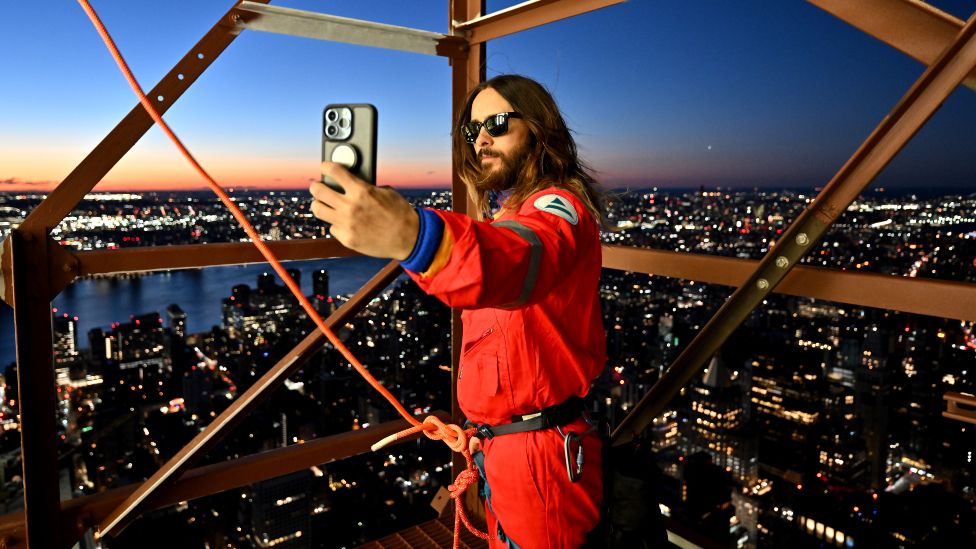 Jared Leto takes a selfie as he gets ready to continue is climb up The Empire State Building on November 08, 2023 in New York City