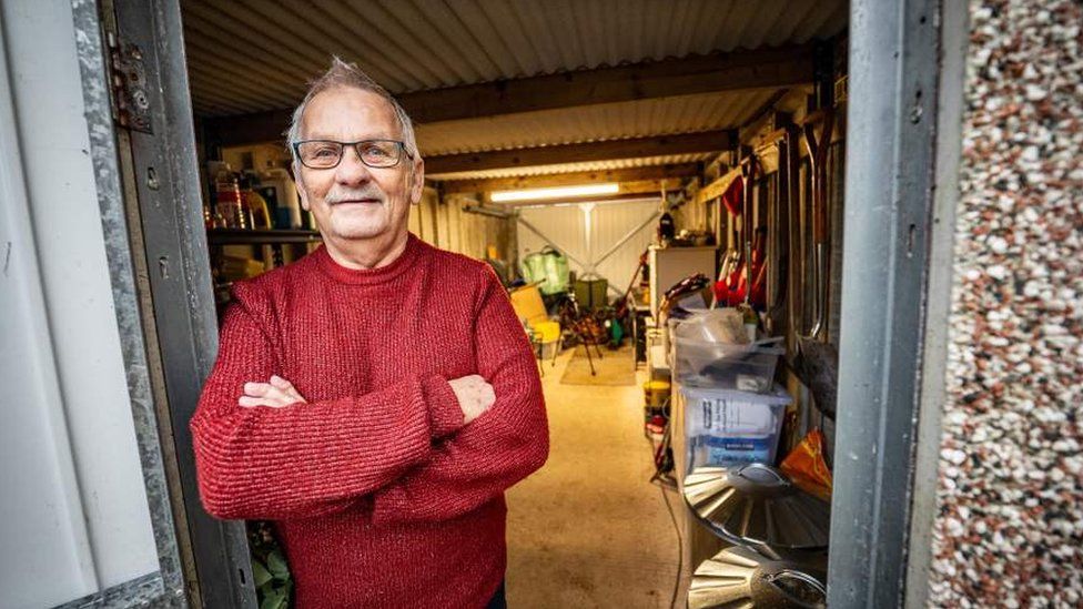 Rodney standing outside his shed