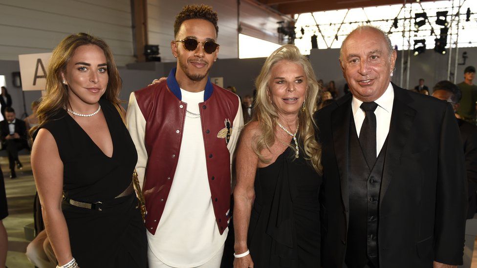 Sir Philip Green, right, with his daughter Chloe, F1 driver Lewis Hamilton, and his wife Tina
