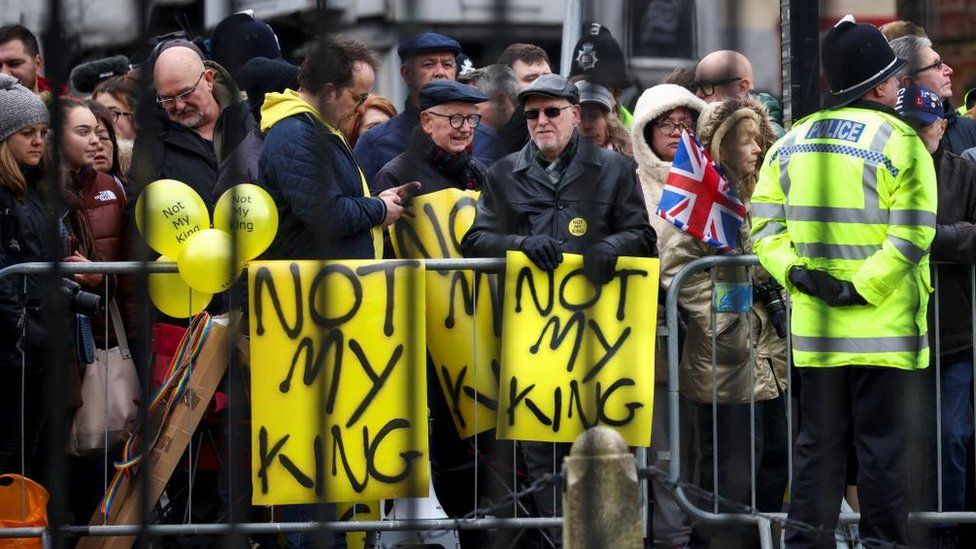 Anti-monarchy protesters awaited the King and Queen Consort's arrival