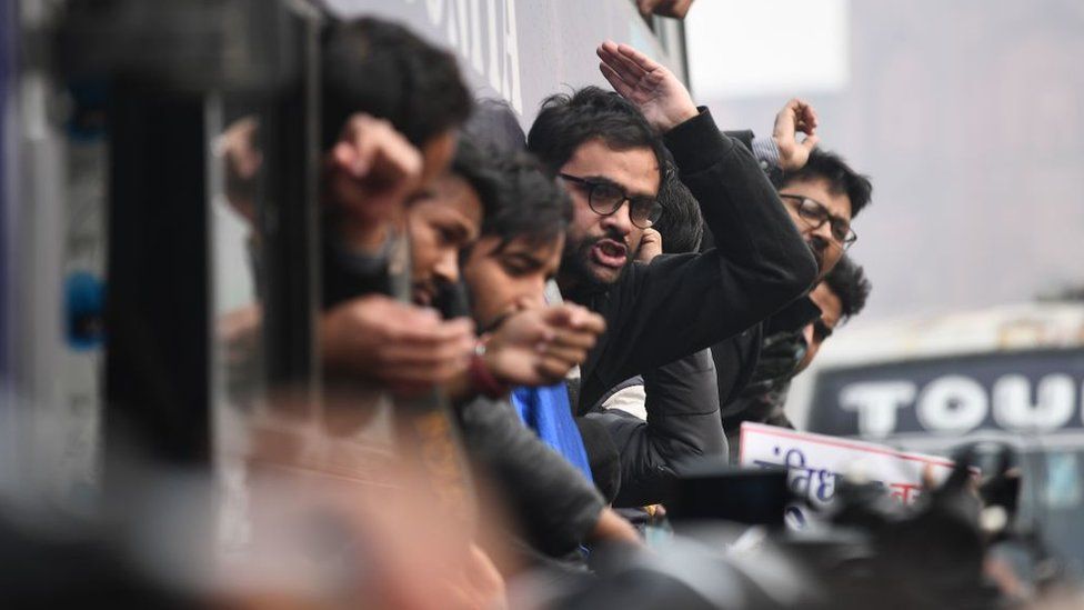 Protesters react from a bus after being arrested at a demonstration against India's new citizenship law in New Delhi on December 19, 2019.