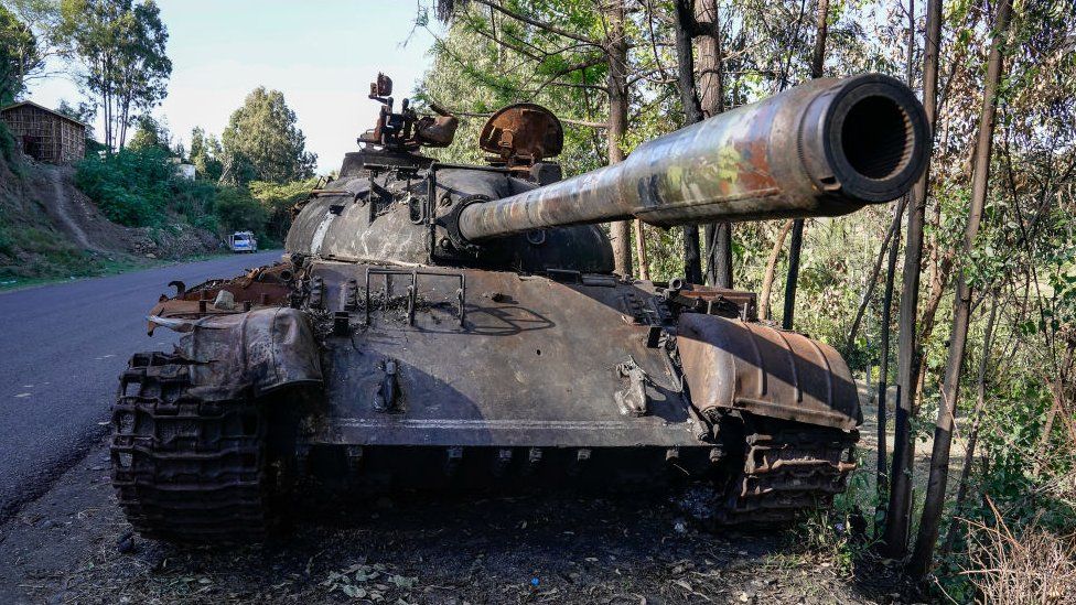 The wreckage of a tank sits along the A2 road outside the city of Haik on January 12, 2022 in the Wollo region, Ethiopia