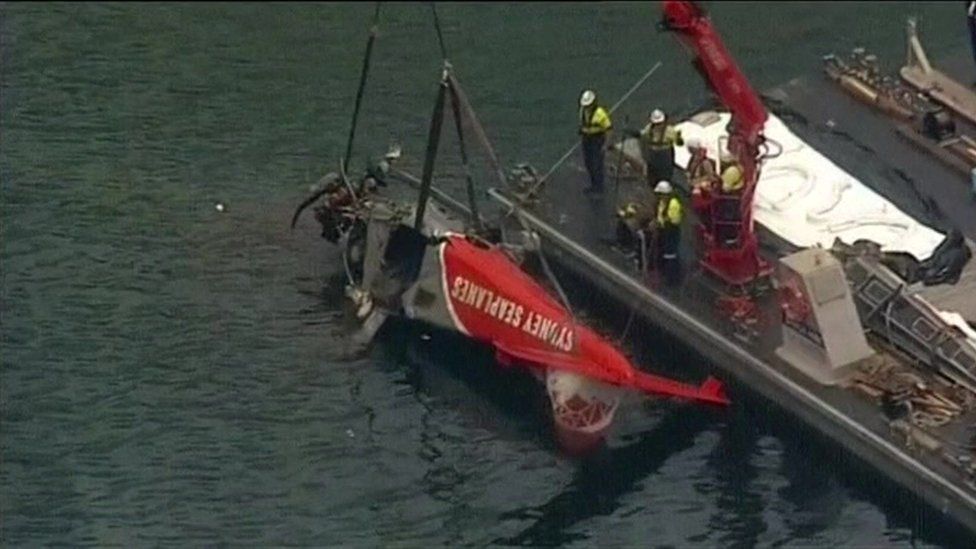 Still from Reuters footage of seaplane being lifted out